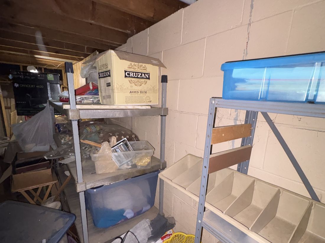 Shelving packed with stored materials throughout the Cudahy basement
