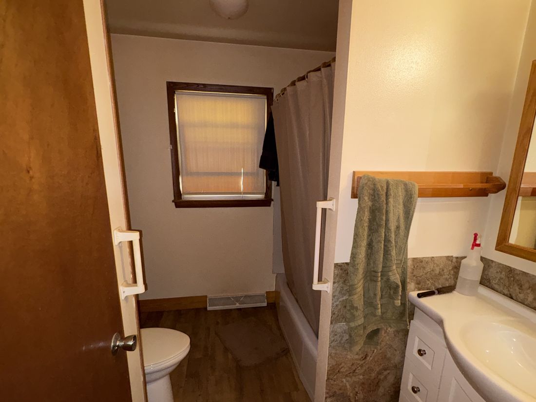 Original bathroom with dated vanity in the Cudahy, Wisconsin ranch