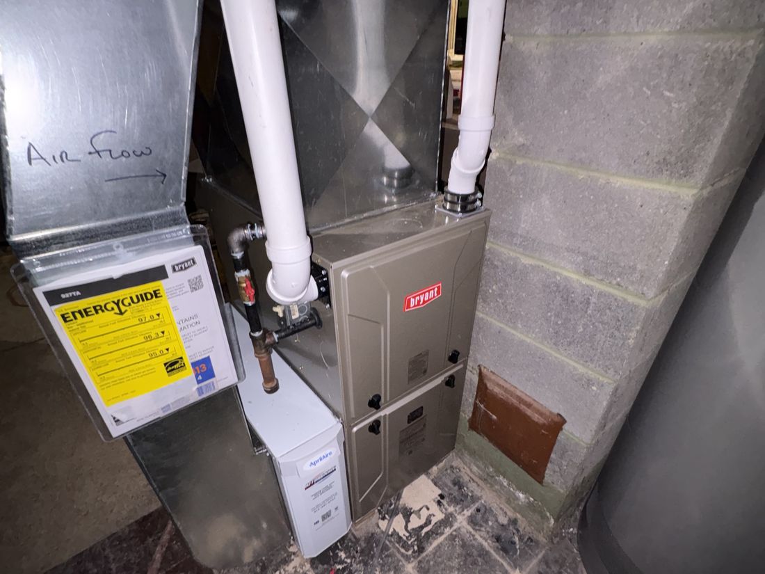 Recently replaced furnace in the packed basement of the Cudahy, WI home
