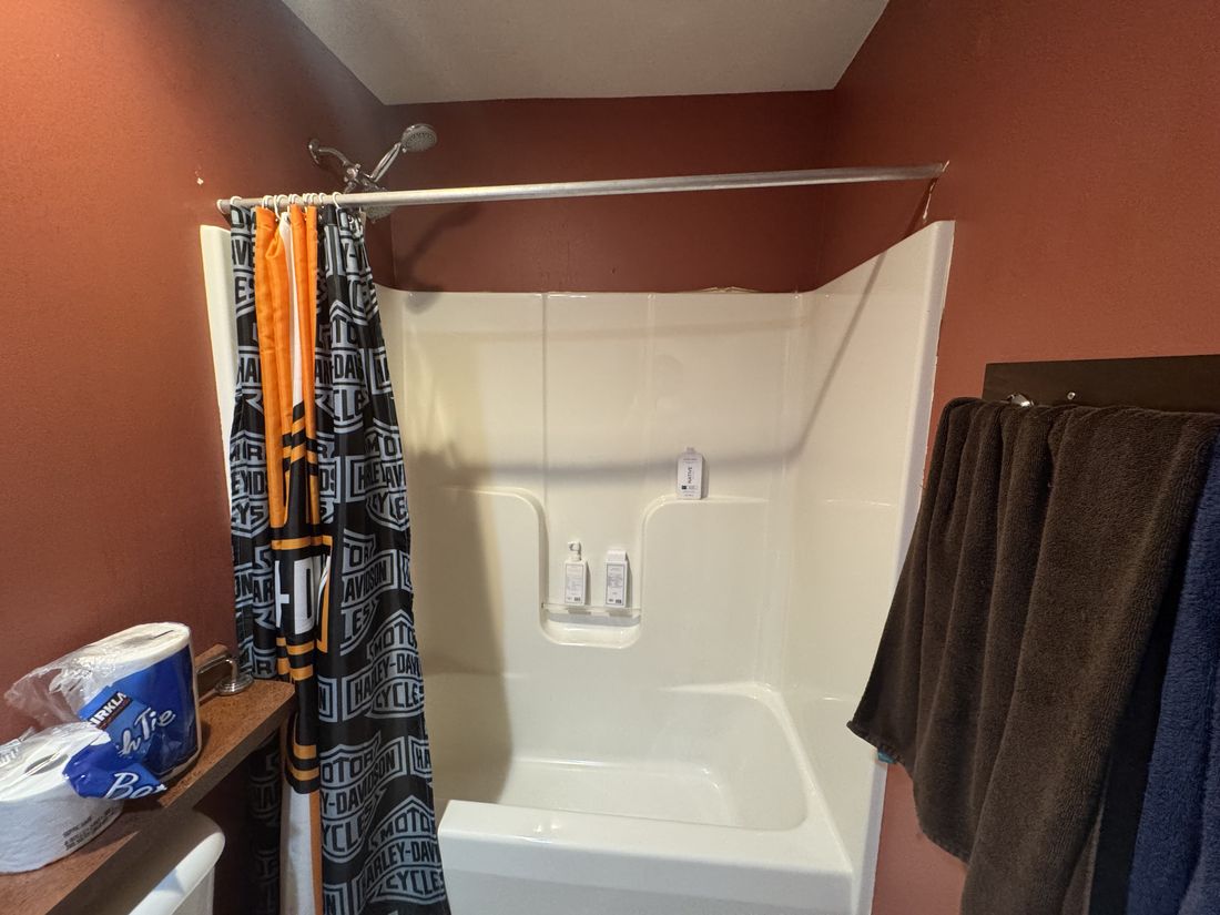 Bathroom with original oak vanity and dated fittings in the Germantown home