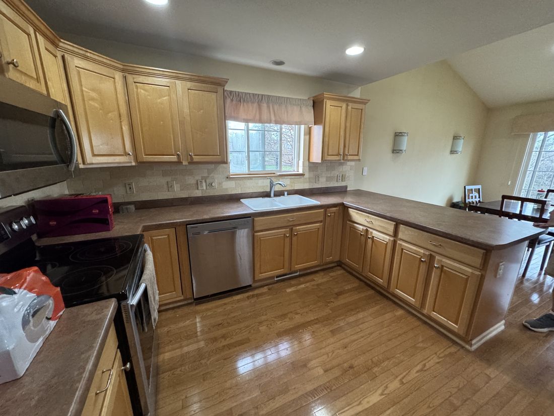 Original oak kitchen with island and full appliance package in Germantown, Wisconsin