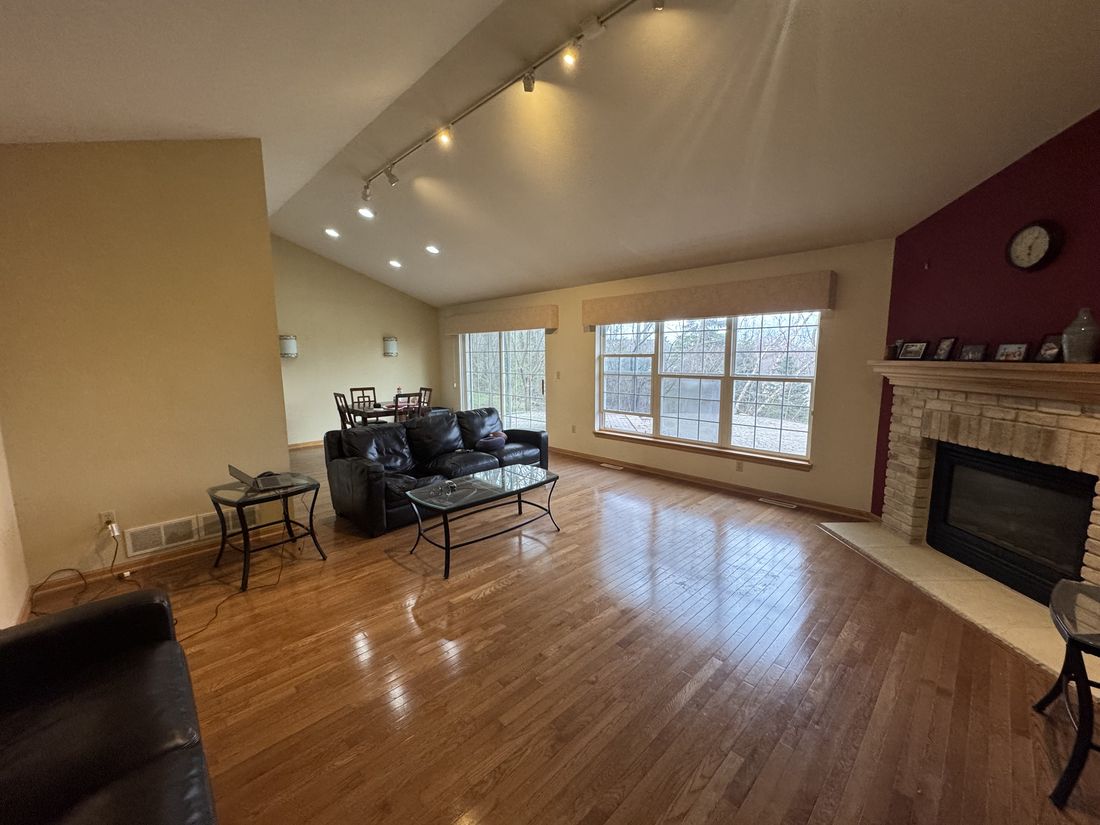 Vaulted living room with fireplace in the Germantown, Wisconsin home