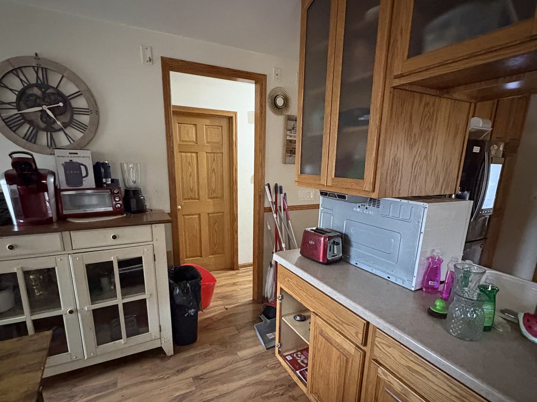 Dining area with built-in hutch and household contents in the Milwaukee property