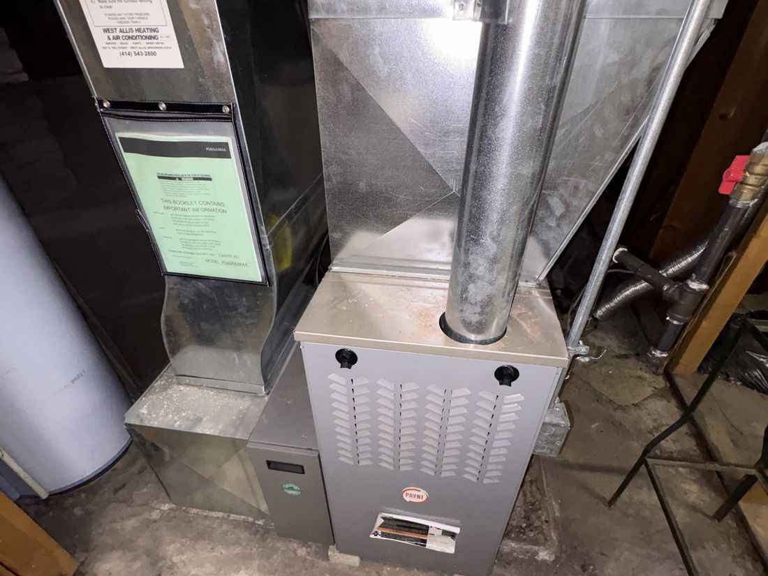 Aging mechanical equipment in the basement of the West Allis, WI duplex