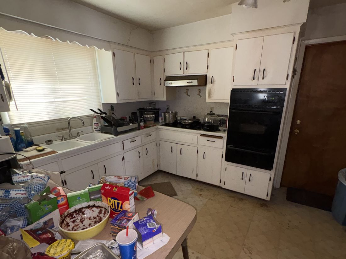 Upper-unit kitchen with original cabinetry in the West Allis, WI duplex