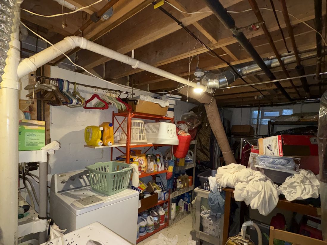 Basement laundry area and mechanical space in the West Allis, WI duplex